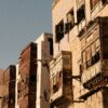 Sunlit traditional architecture in Al-Balad, Jeddah, showcasing historic charm and intricate design.