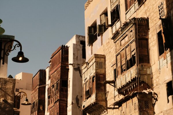 Sunlit traditional architecture in Al-Balad, Jeddah, showcasing historic charm and intricate design.